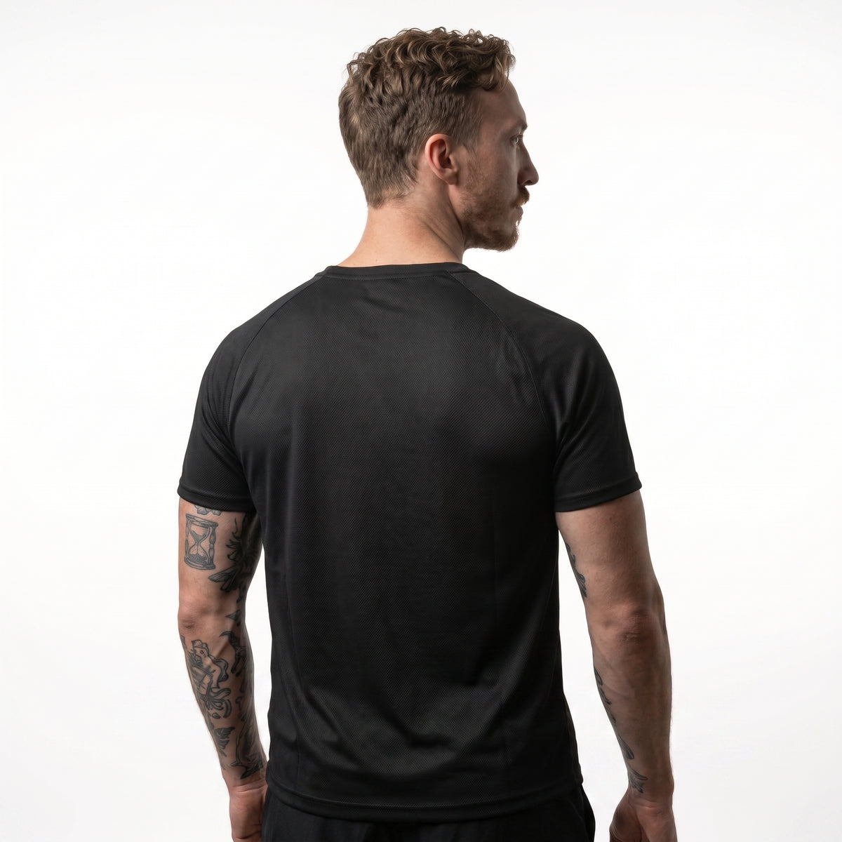 Back view of the KING Men's Sports Jersey in black featuring an athletic fit and premium performance fabric.