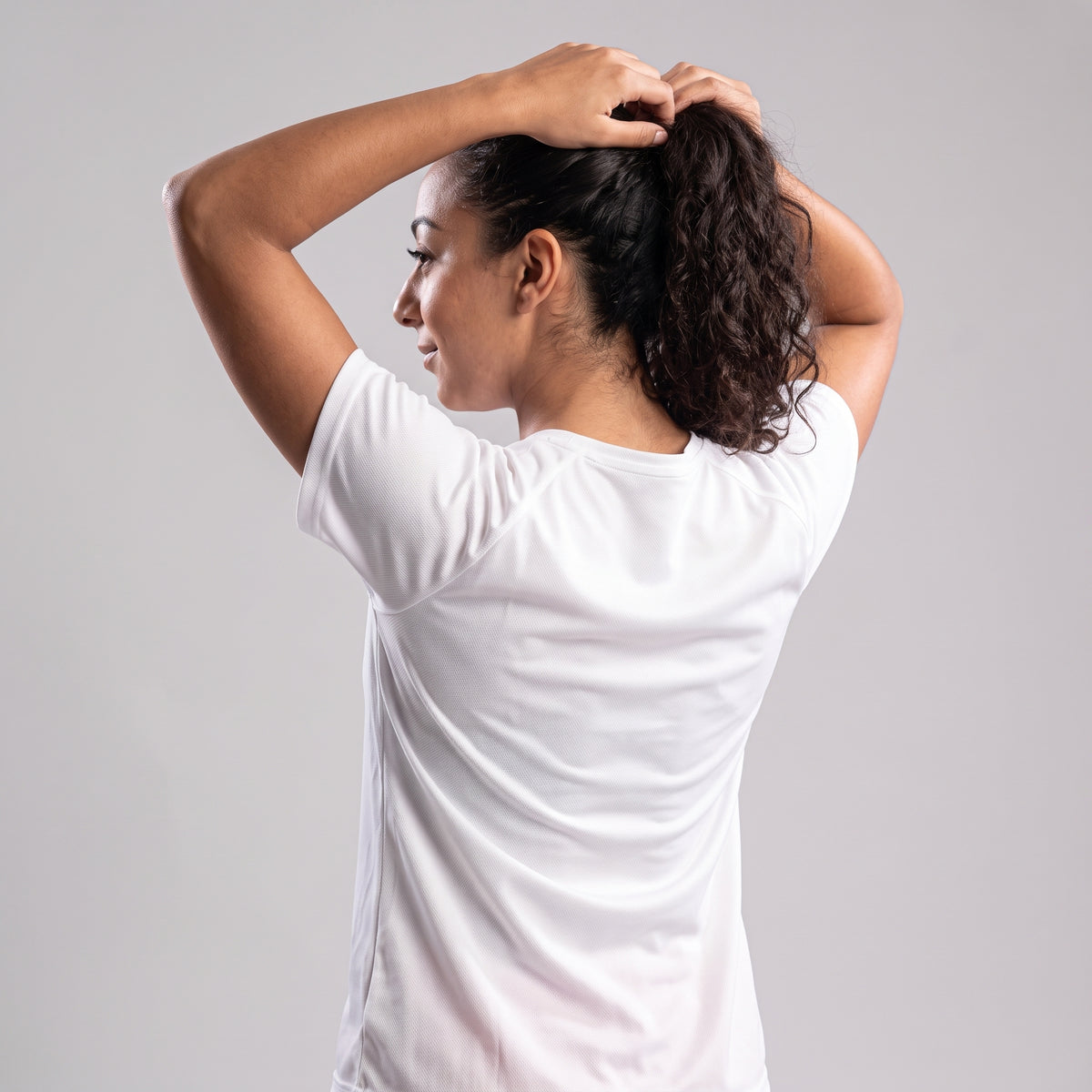 Back-over-shoulder view of white KING Sports Jersey, geometric lioness edition