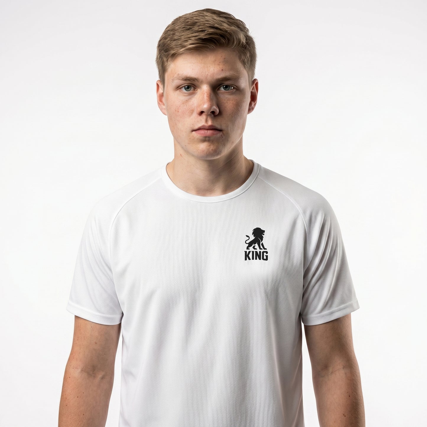 White KING sports jersey with minimal lion chest emblem – model front view.