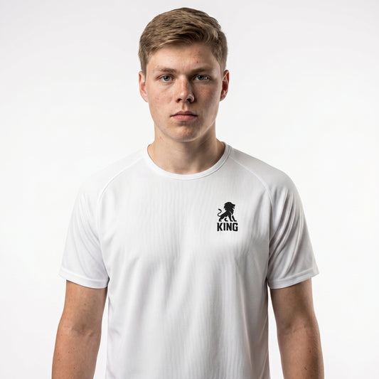 White KING sports jersey with minimal lion chest emblem – model front view.