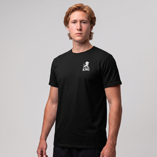 Male model wearing the KING Sports Tee in black with minimal lion chest logo, three-quarter front view.