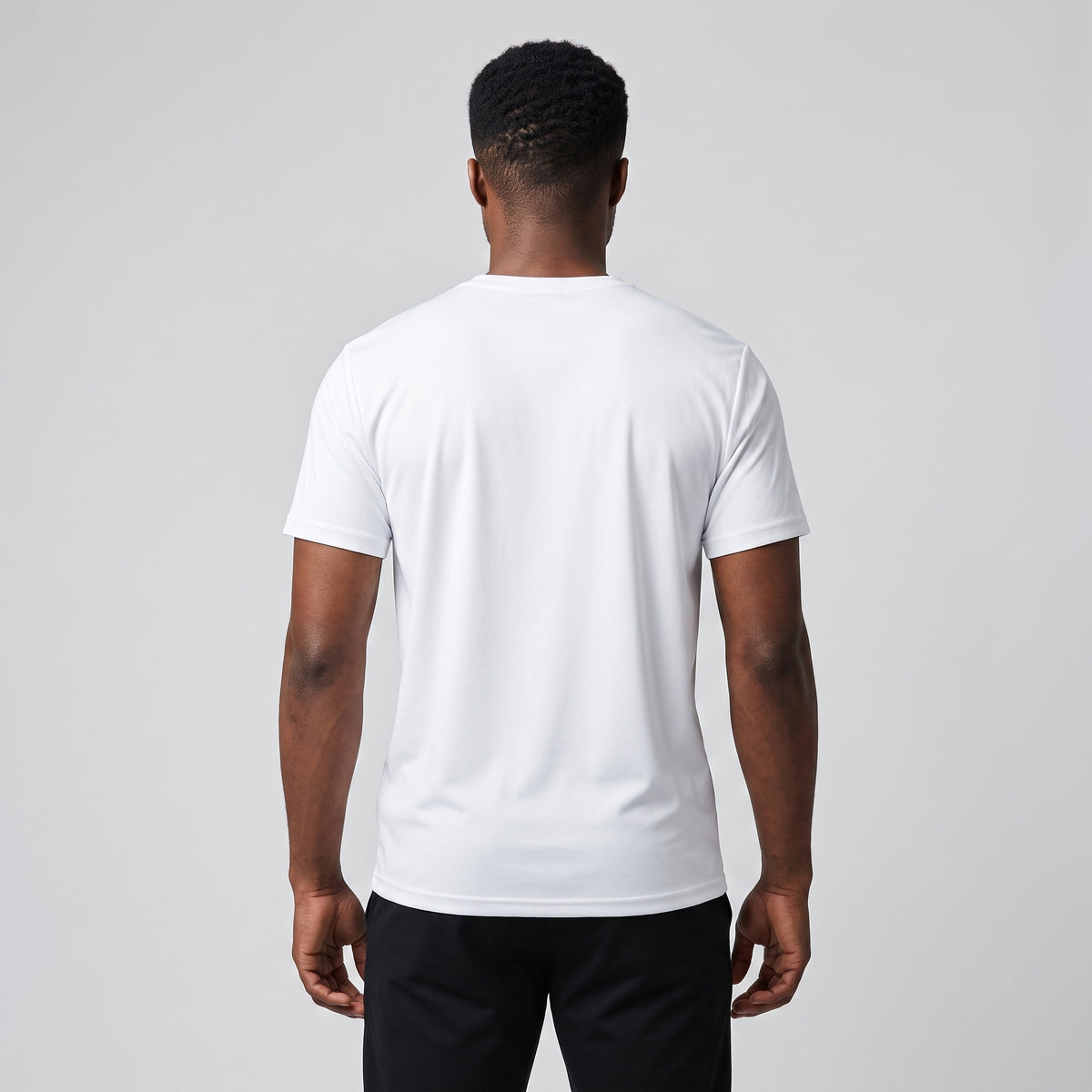 Male model wearing the KING Sports Tee in white, full back view showing the relaxed athletic fit.