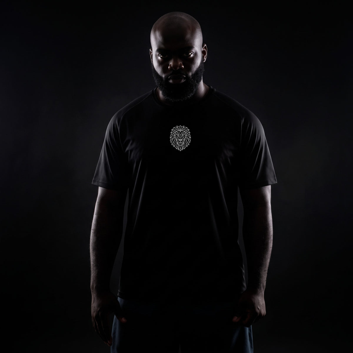 Model wearing the black KING APEX Lion geometric design