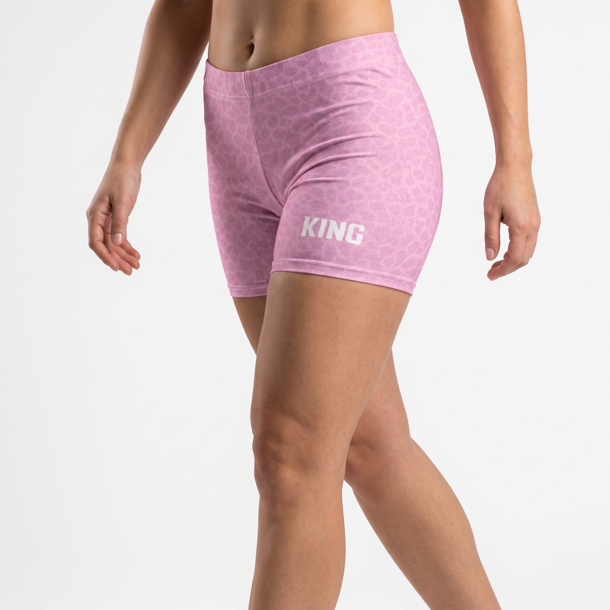 Premium women's training shorts with Blush Pattern shown in a natural walking pose.