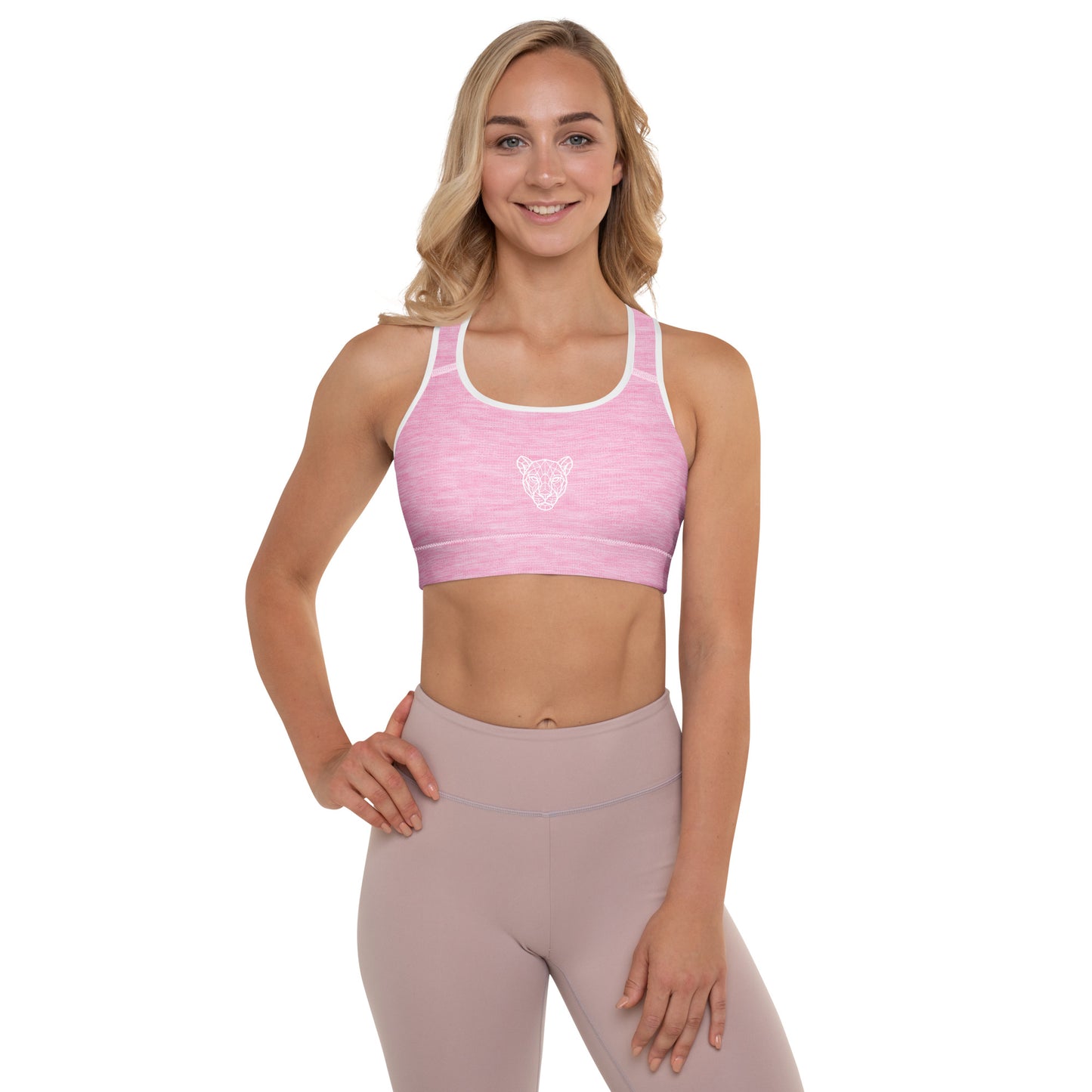 Lioness pink padded sports bra with geometric lioness logo, front view on female model by KING APEX
