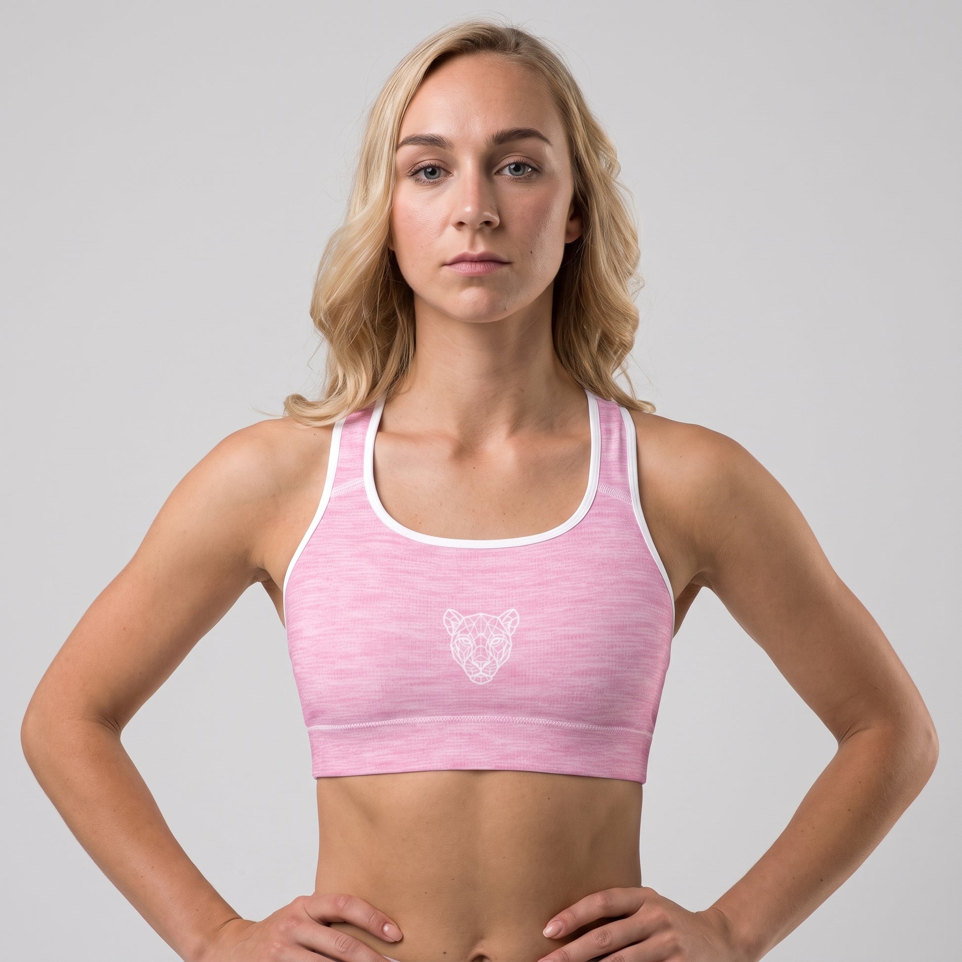 Woman wearing the KING Lioness Pink Padded Sports Bra from the front.