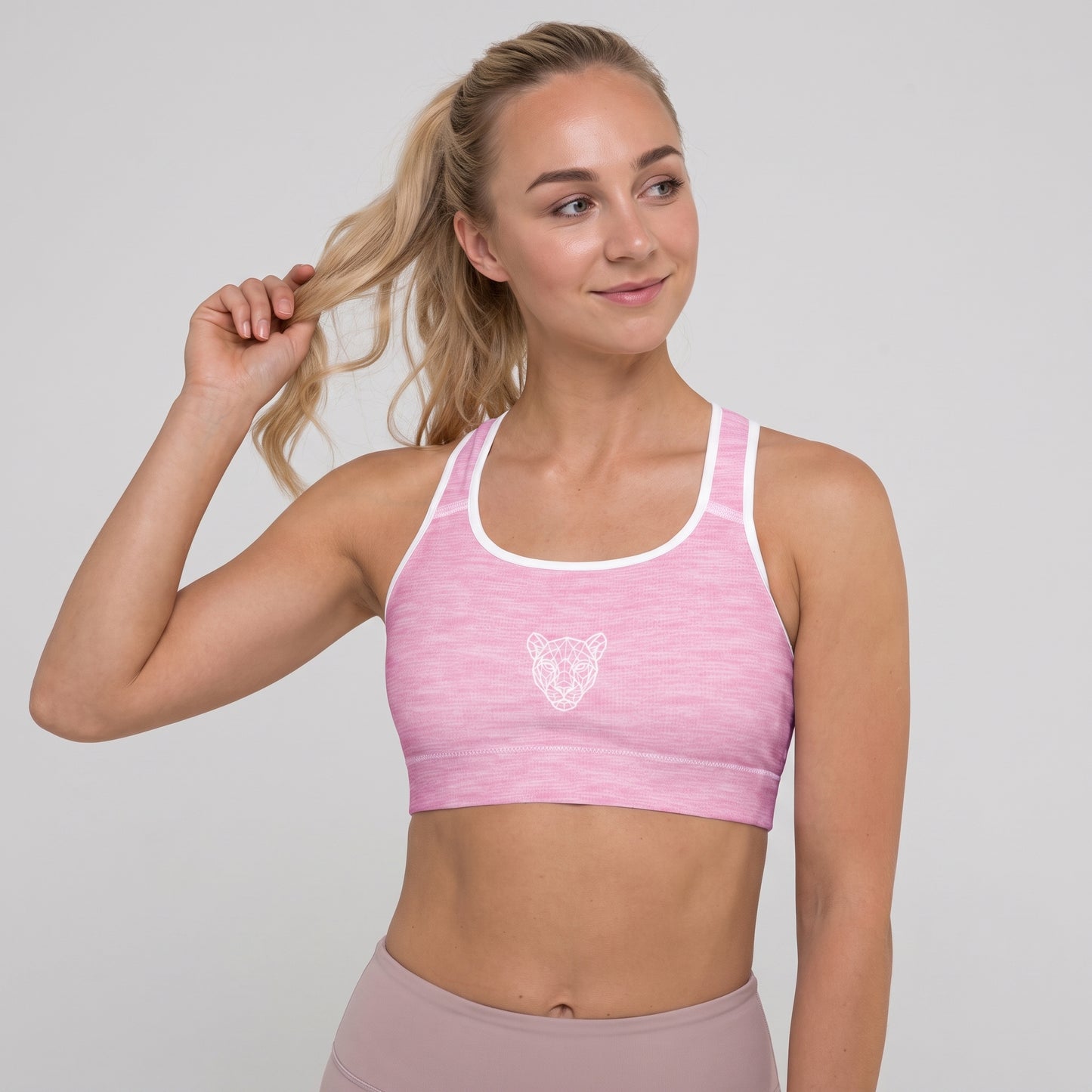 Front view of the KING Lioness Pink Padded Sports Bra on a female model.