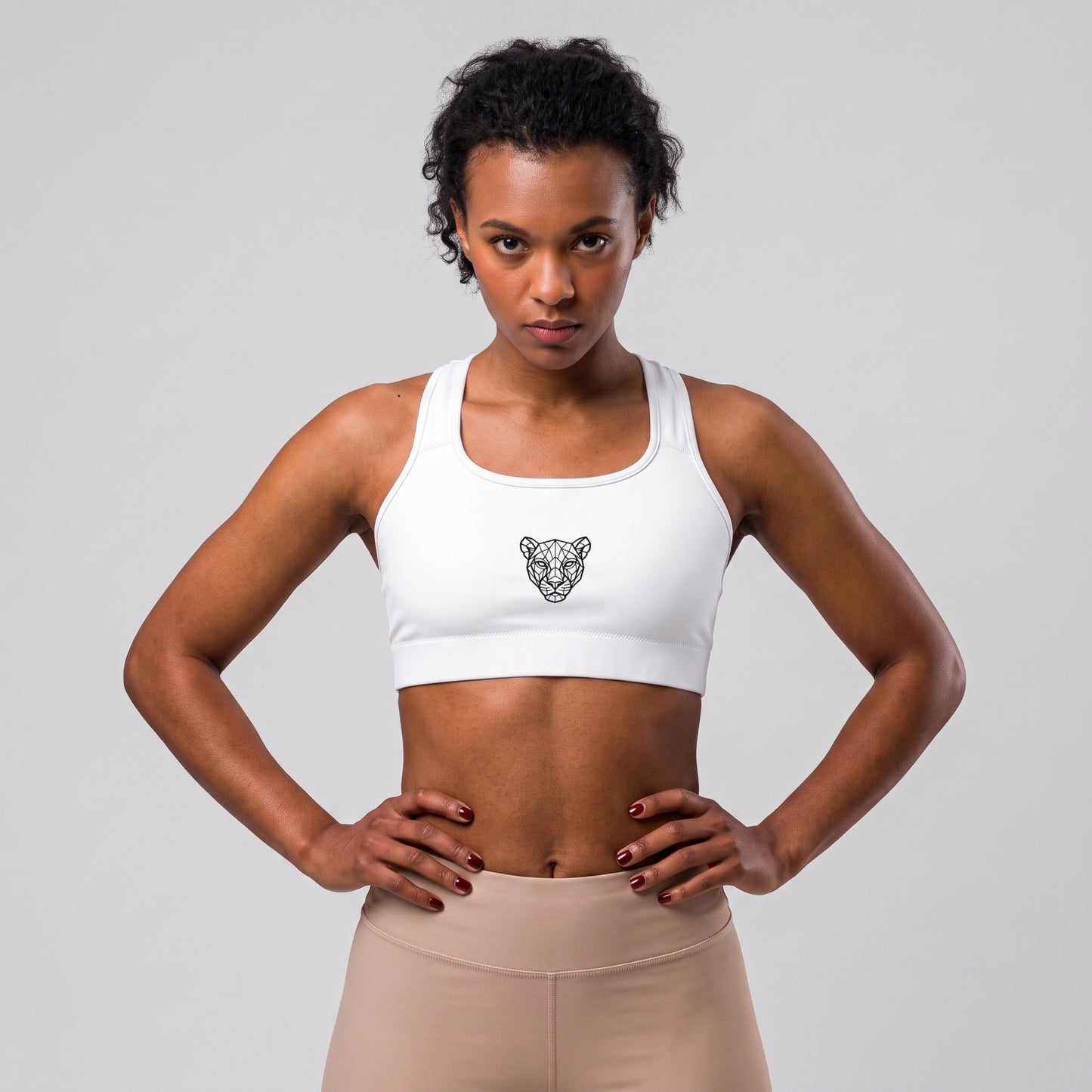 Female model wearing the KING Lioness Sports Bra in black.