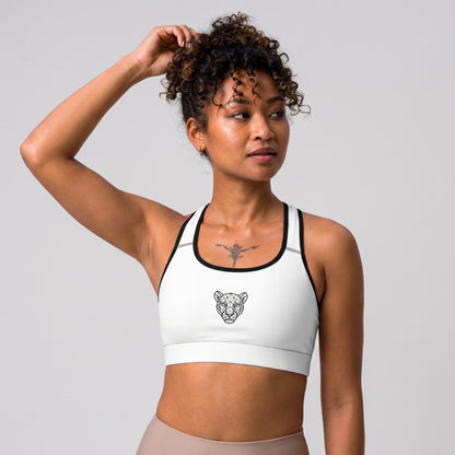 Close-up front view of the KING Lioness Sports Bra in white with black piping.
